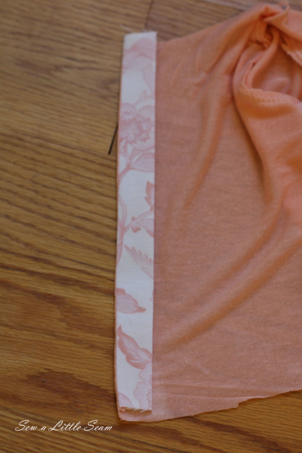 Open up your placket piece and press, and then fold it over along the edge so that you can only see one fabric from each side and press.