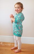 Hooded tunic with 3/4 length sleeves and bands