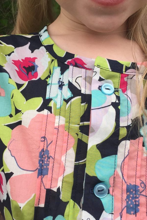 Pintucks and flutter sleeve Pintucks and flutter sleeve